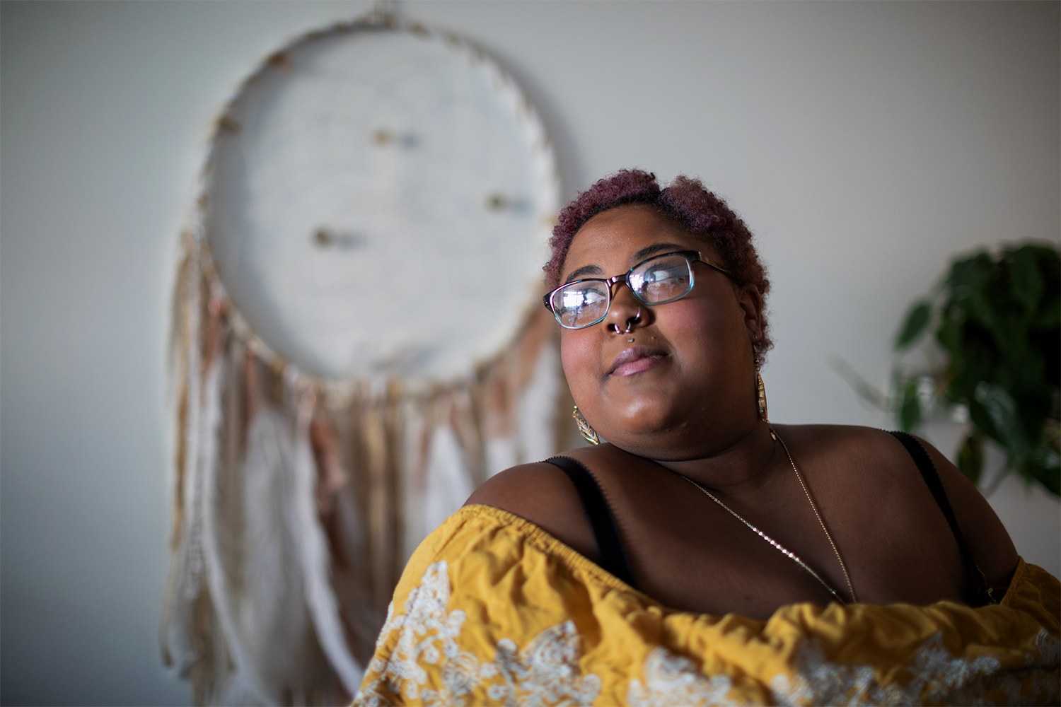 A plus-size Black woman smiling confidently
